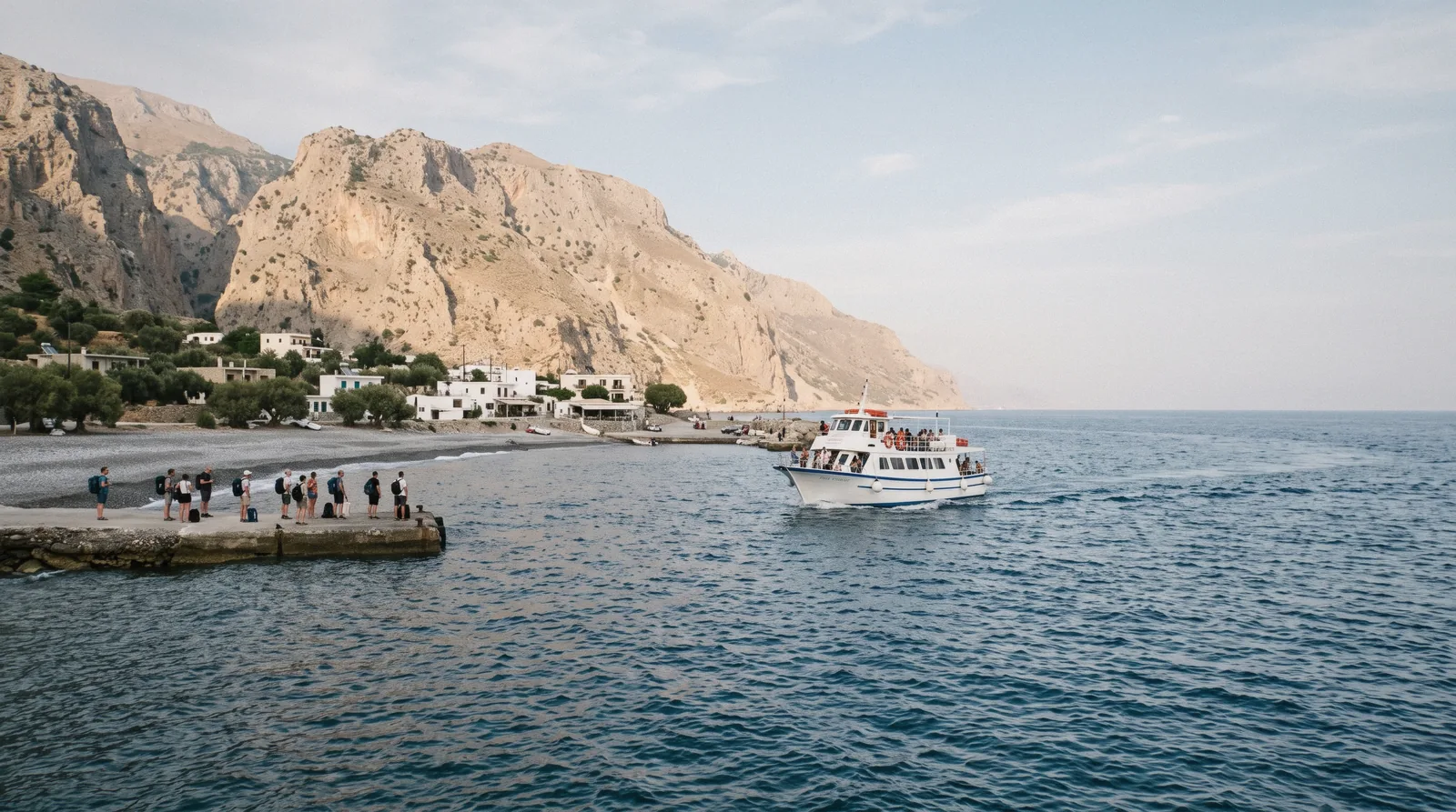 A passenger ferry docked at Agia Roumeli where hikers leave Samaria Gorge by boat, Crete