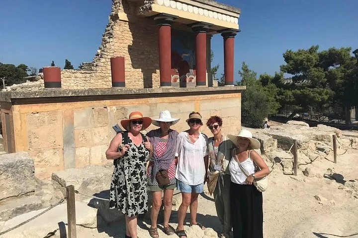 Visitors on the grand staircase at Knossos on a guided skip-the-line group tour, Crete Greece
