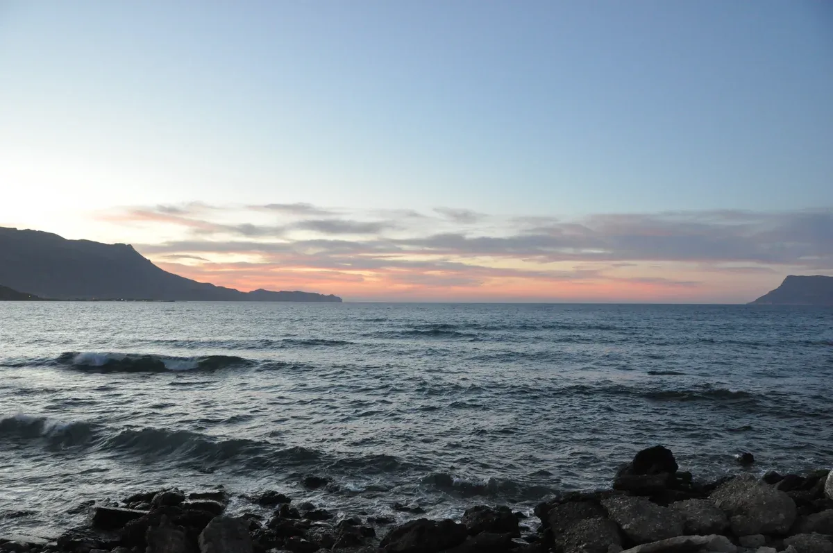 The Bay of Kissamos at dusk with the Gramvousa and Rodopos peninsulas, the route the Balos boat sails from Kissamos