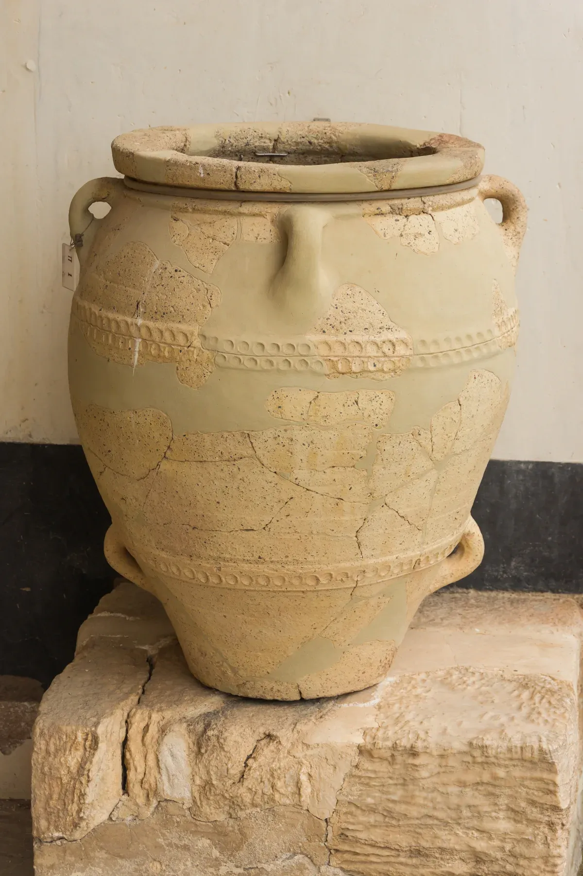 A large storage pithos jar at Knossos, part of a Crete tickets visit
