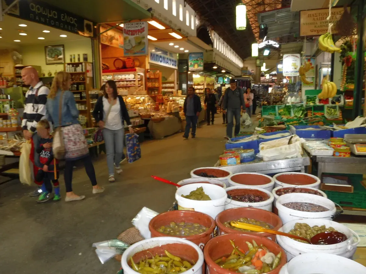 Barrels of olives and local produce inside Chania's covered market, a crete food stop